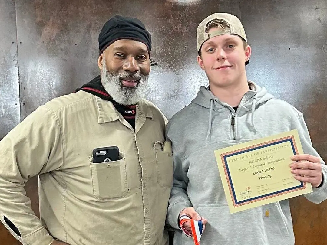 student welder and instructor
